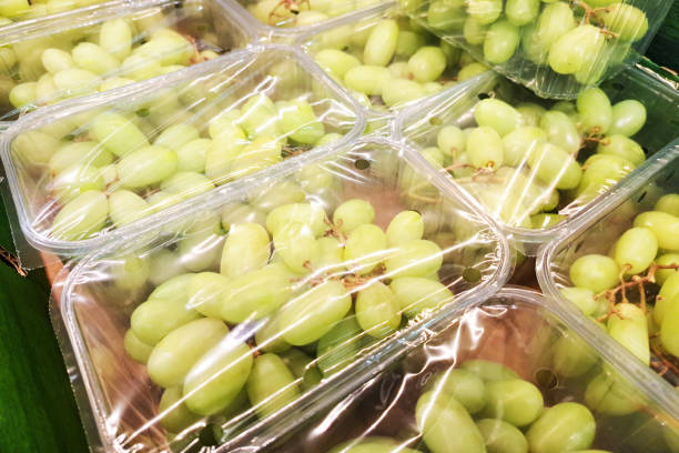 istock Packaged green grapes in plastic wrapping. Fresh fruit in food industry packaging. Ready-to-eat produce in plastic containers. 2194669908