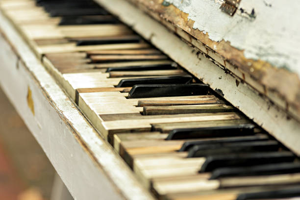 istock A close up of an old piano with peeling paint on it 2194670422