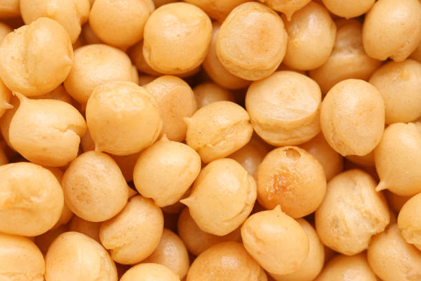 Puff croutons background. Crispy soup additive. Closeup meal toppings.