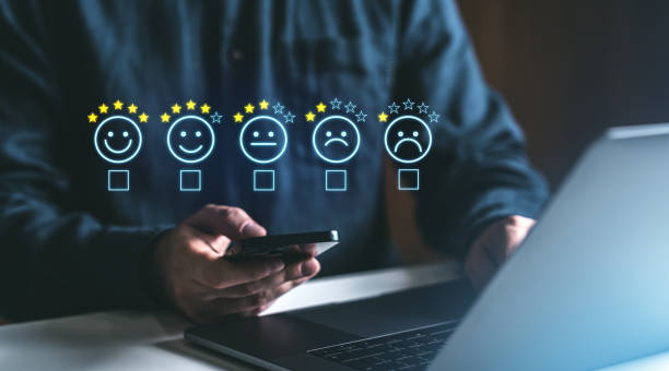 istock Customer feedback survey with star ratings and emoticons on digital platforms. 2194670678
