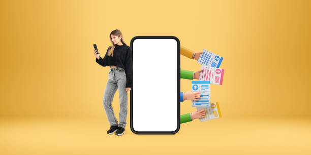 istock Smartphone mockup with blank white screen alongside a person hol 2194670902