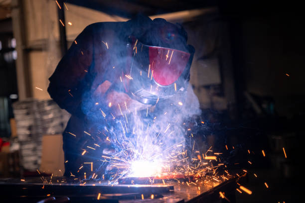 istock Welder joining metals with sparks flying in workshop 2194671916