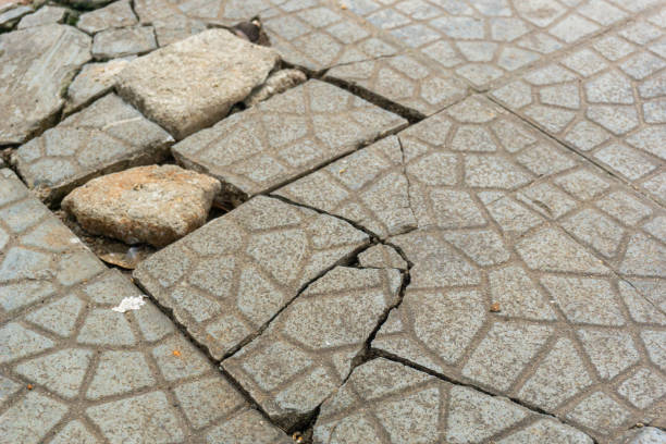 istock the sidewalk floor is damaged and needs repair 2194672954