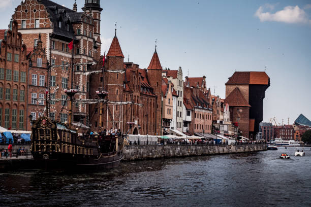 istock Historic Gdansk waterfront with medieval architecture, motlawa river and docked ship 2194674228