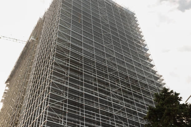 istock Metal Scaffolding on Building Facade, modern construction, scaffold bars, construction safety 2194675915