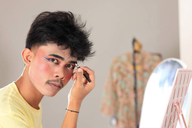 istock Young Indonesian Traditional Male Dancer Applying Eyebrow 2194676318