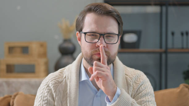 istock Silence Please Gesture by Mature Adult Man at Home 2194676548