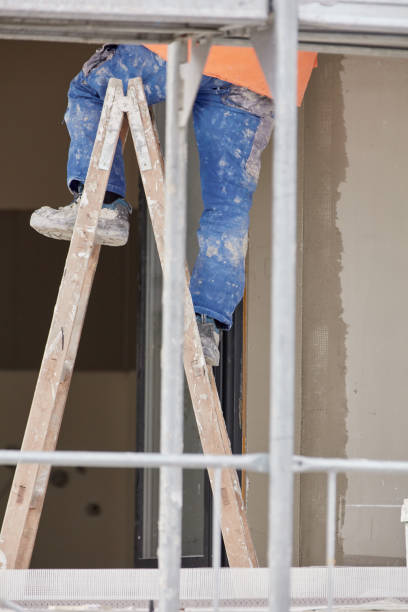 istock Repairman working on a new building facade. 2194676767