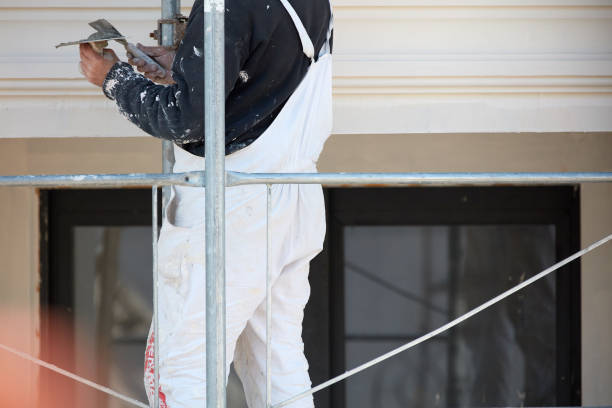 istock Repairman working on a new building facade. 2194676819