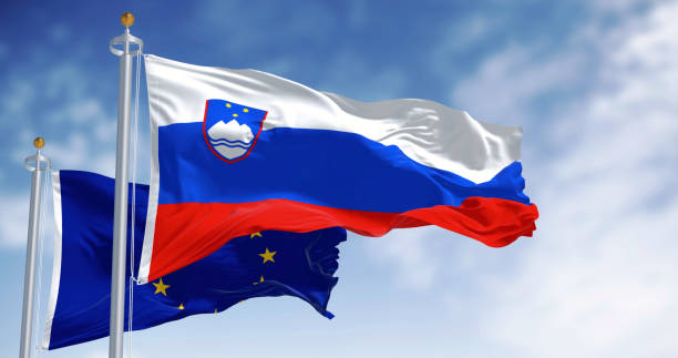 istock Slovenia and the EU flags waving on a clear day 2194678551