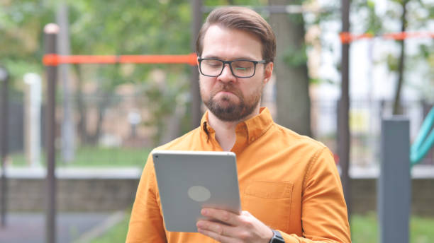 istock Portrait of Young Man with Loss on Digital Tablet 2194679311