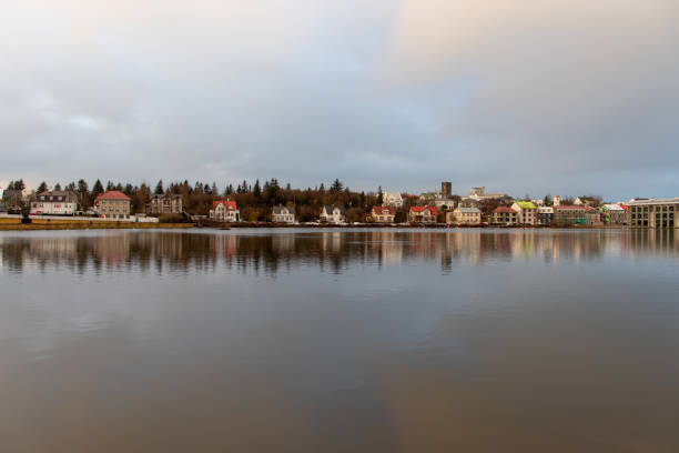This set of photos showcases the urban landscape of Reykjavik, the capital of Iceland. It includes images of the city center's architecture, vibrant squares, the iconic white swan statues, bustling commercial streets, and the grand churches. Reykjavik is known for its unique blend of modern architecture and natural beauty, with cultural landmarks like Hallgrímskirkja Church standing tall. The city is a perfect mix of urban life and stunning natural surroundings, making it a must-visit destination in Iceland.