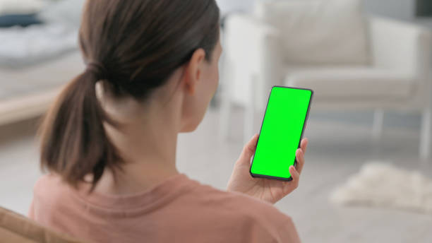 istock Woman Using Chroma Key Smartphone at Home 2194680669