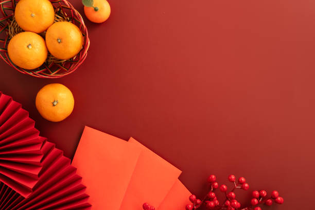 istock Chinese lunar new year background with fresh tangerine and red envelope. 2194681415
