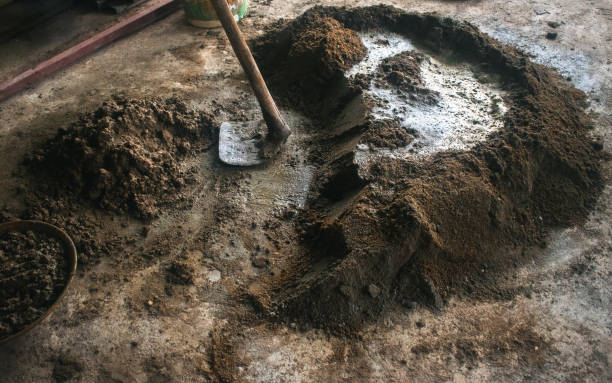 istock Mixture of cement and sand with shovel on construction site, close up shot. 2194682015