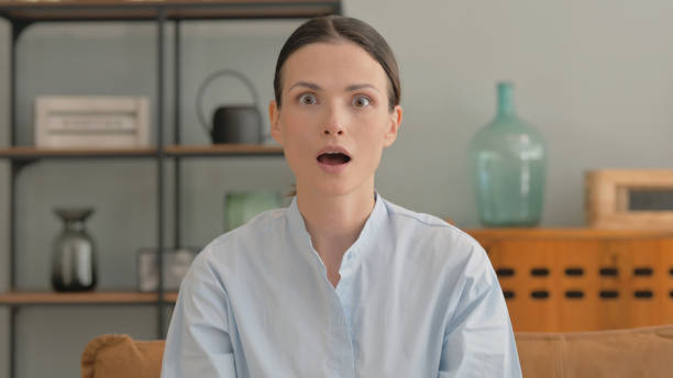 istock Surprised Young Woman Wondering while at Home 2194683509