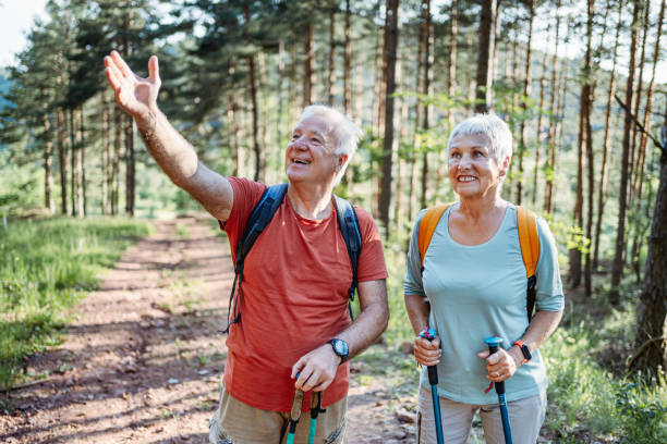 istock Senior couple enjoys a hike in the forest 2194684470