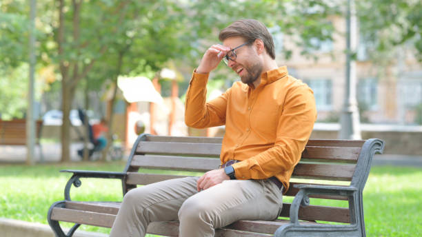 istock Tense Young Man with Migraine Sitting Outdoor 2194685026