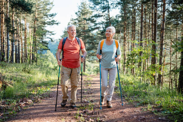istock Senior couple hiking together in the forest 2194685057