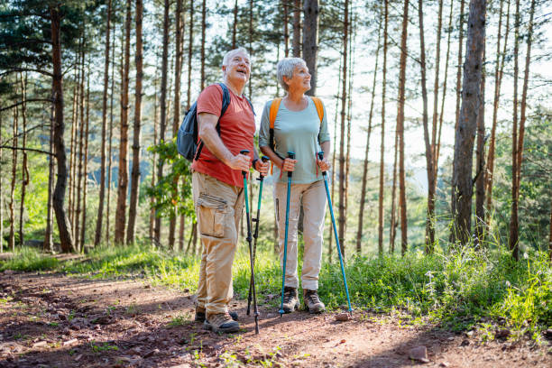 istock Senior couple hiking together in the forest 2194685217