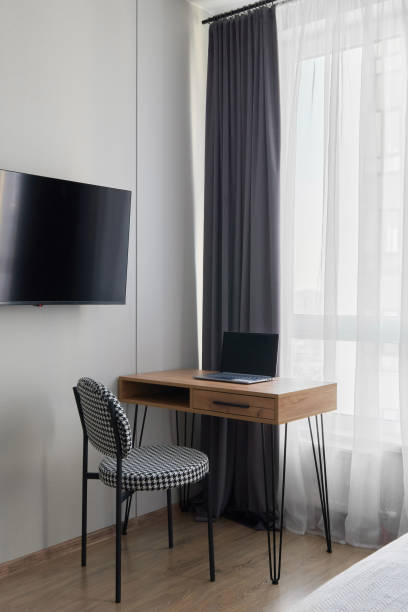 istock A Modern Workspace Featuring a Desk and a TV in a Bright and Inviting Room Space 2194685255