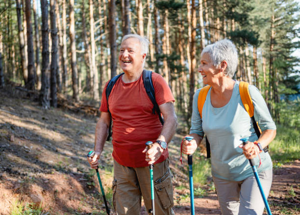 istock Senior couple enjoys a hike in the forest 2194685442