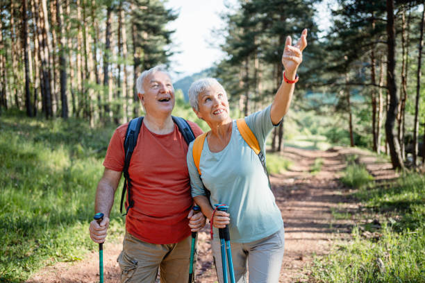 istock Senior couple hiking together in the forest 2194685725