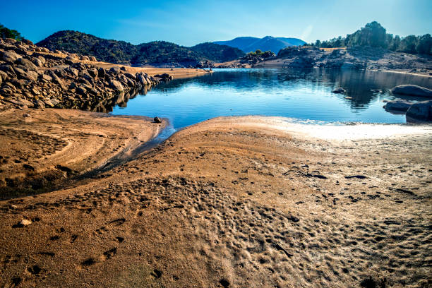 Drought at Burguillo reservoir on a sunny day. Iruelas Valley. Avila.