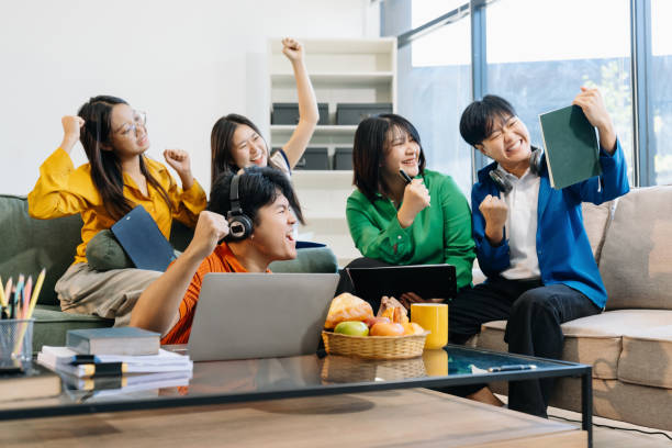 istock college students feel excited overjoyed triumph with good news over. 2194687685