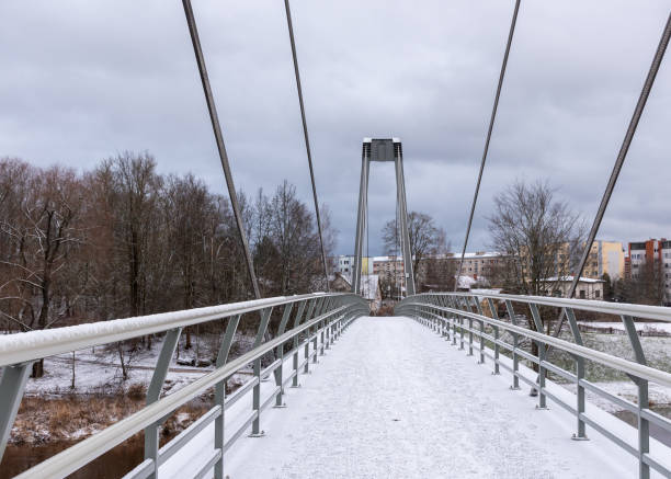 istock winter landscape with a bridge over the river, winter day, snow-covered trees 2194688025
