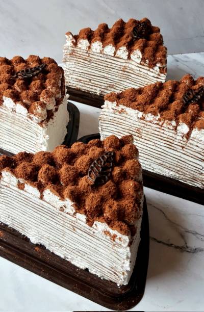 Mille Crêpes is a delicate French-inspired cake made from many thin crêpes layered with light pastry cream. Soft and creamy with a melt-in-the-mouth texture, this cake offers a refined, subtly sweet treat perfect for special occasions or afternoon tea. mille crêpes is a delicate french-inspired cake made from many thin crêpes layered with light pastry cream. soft and creamy with a melt-in-the-mouth texture, this cake offers a refined, subtly sweet treat perfect for special occasions or afternoon tea.