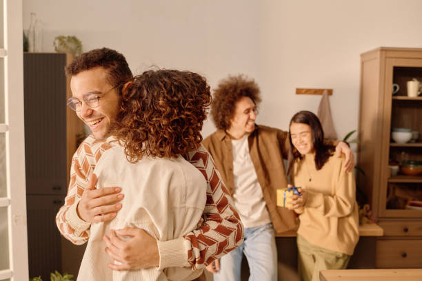 istock Happy Man Hugging His Female Friend 2194689436