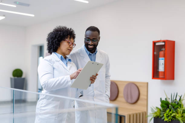 istock Two doctors analyzing medical records in hospital corridor 2194689830