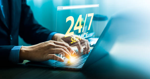 istock Hands Typing on Laptop with 24/7 Service Icon Displayed, Representing Customer Support, Technical Assistance, Online Help, and Continuous Availability for Business and Technology Solutions 2194690699