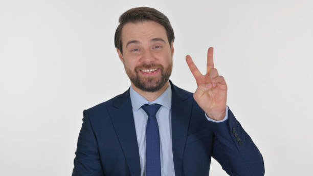 istock Middle Aged Businessman with Victory Sign on White Background 2194691390