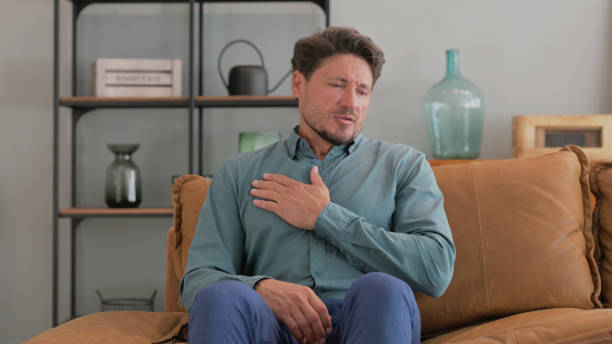 istock Middle Aged Man with Chest Pain at Home 2194693588