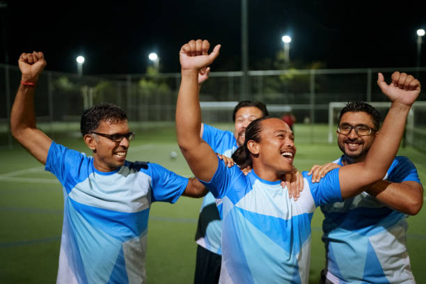 istock Soccer players celebrating goal scored 2194693878