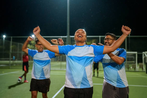 istock Soccer players celebrating goal scored 2194693952