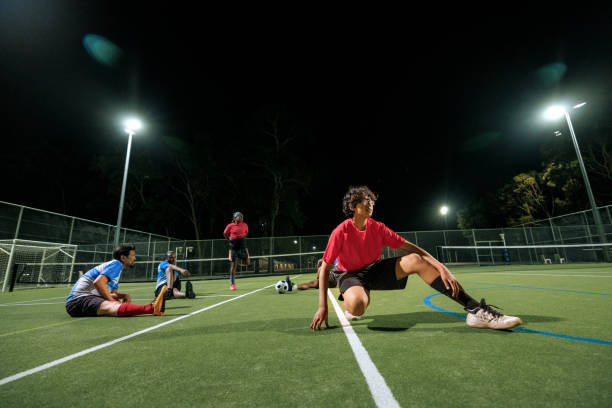 istock Soccer player warming up on a soccer field during training session 2194694012