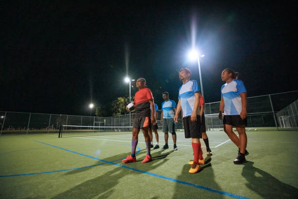 istock Soccer players walking together on soccer field during training session 2194694046