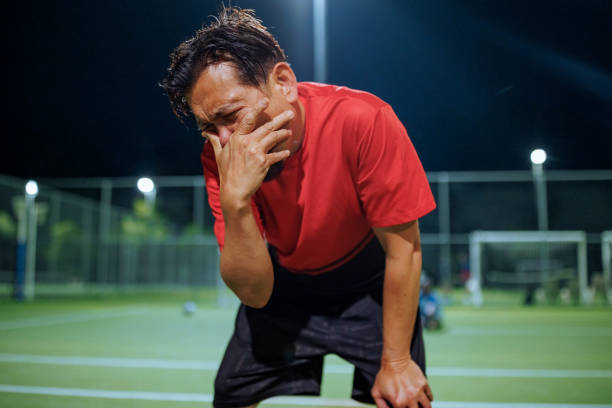 istock Frustrated soccer player on a soccer field after lost match 2194694073