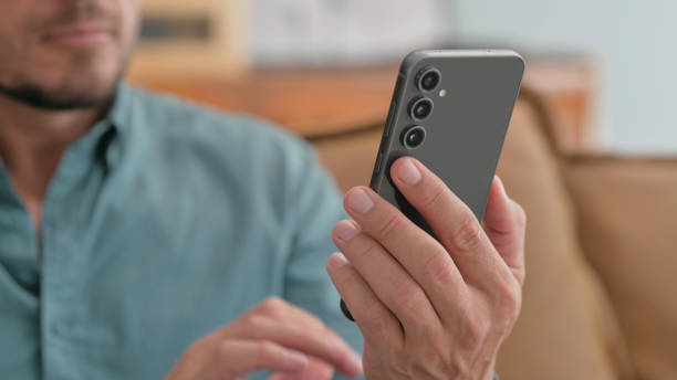 istock Close up of Man Using Smart Phone 2194694627