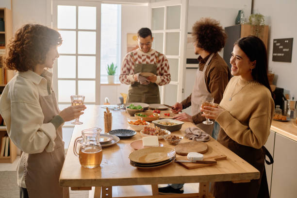 istock Friends Chatting Lovely in Kitchen 2194696916