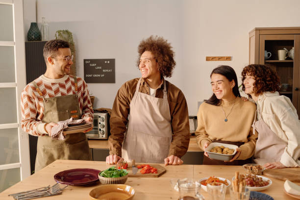 istock Company of Friends Serving Dining Table 2194696944