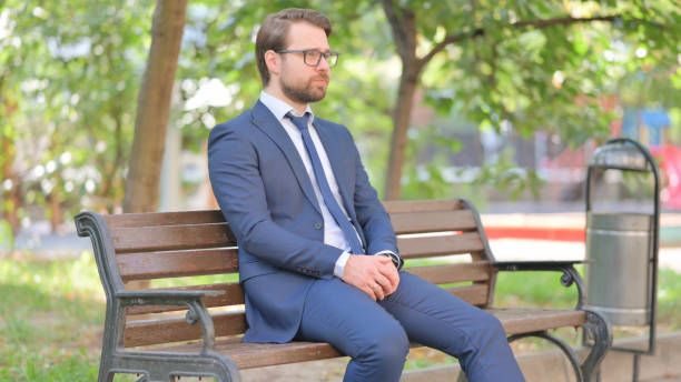 istock Beard Businessman Sitting Outdoor on Bench 2194698923