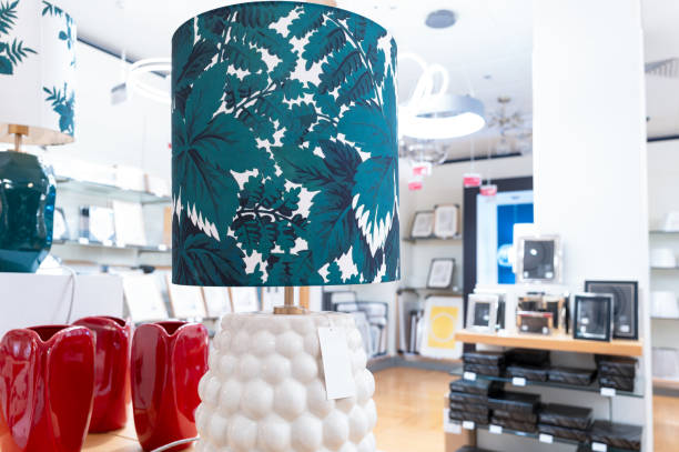 istock Colourful fabric lampshade with ceramic base seen in the lighting section of a typical British department store. 2194699279