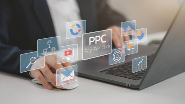 istock PPC - Pay Per Click concept. Businessmen working on laptops, social networks, SEO 2194701857