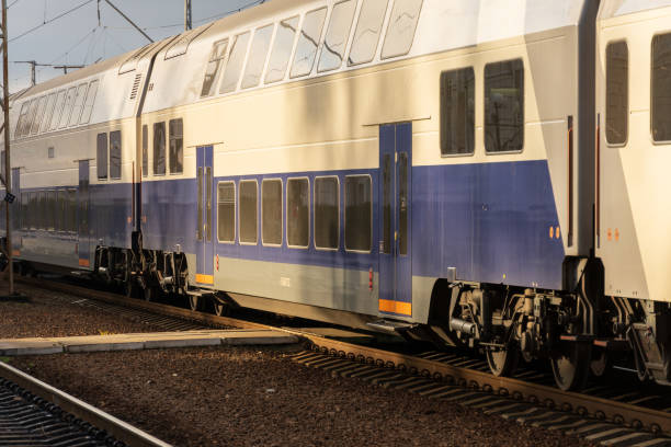 istock A sleek electric train approaches the platform at a bustling station, showcasing contemporary railway design and efficient transportation 2194702914