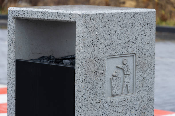 istock Urban area features a concrete garbage container designed for efficient waste disposal and environmental conservation practices 2194702943