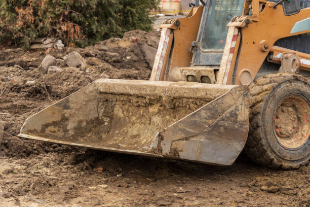 istock Heavy machinery is actively digging at a construction site, demonstrating the vital work of engineers in the construction industry 2194703000